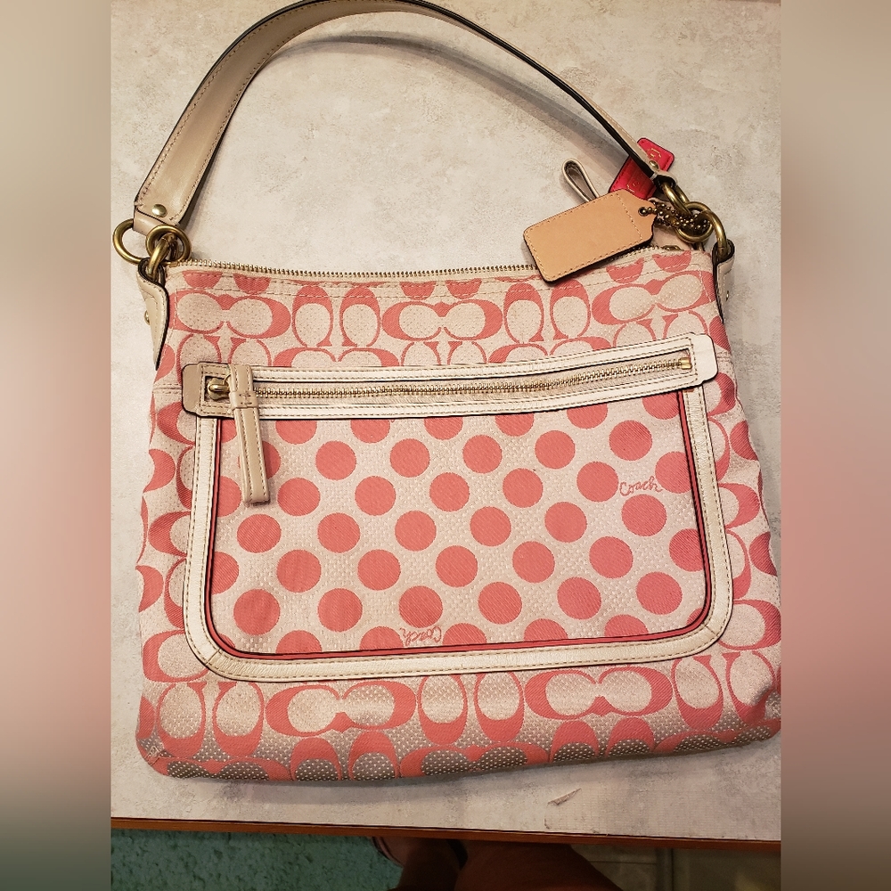 Beautiful cream and coral Coach purse. No flaws. Used once. Excellent condition.